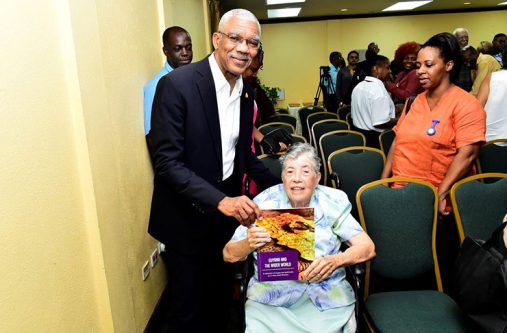 President Granger posed for a picture with his former History lecturer, the 87-year old Sister Mary Noel Menezes holding a copy of her book