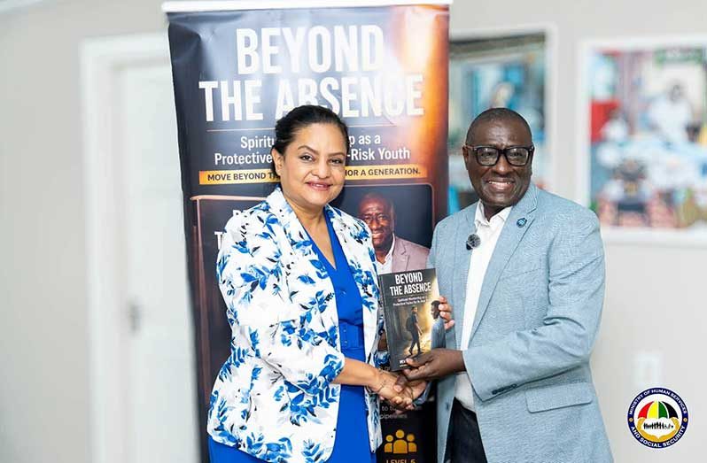 Minister of Human Services and Social Security, Dr Vindhya Persaud, receives a copy of Dr Winston Assanah’s newly published book, which was inspired by his research conducted through a youth intervention programme supported by the Ministry