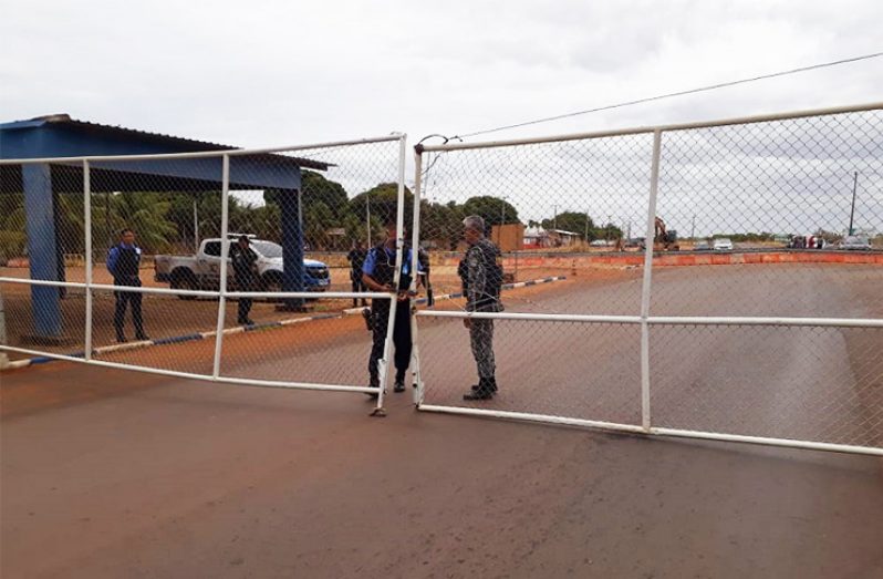 Brazil's military police at a gate along the highway linking Lethem with Bom Fin. The gate was closed on Thursday in accordance with an order made by the Brazilian government.
