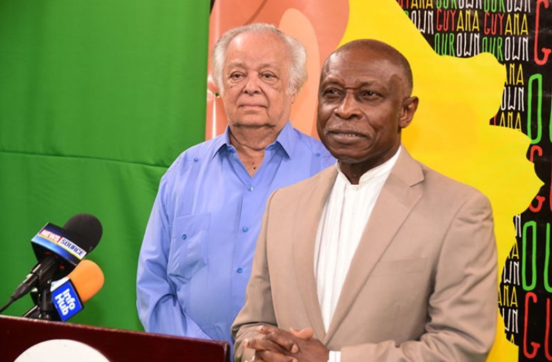 Acting Prime Minister and Minister of Foreign Affairs, Carl Greenidge addresses the media as Sir Shridath Ramphal looks on (Adrian Narine photo)
