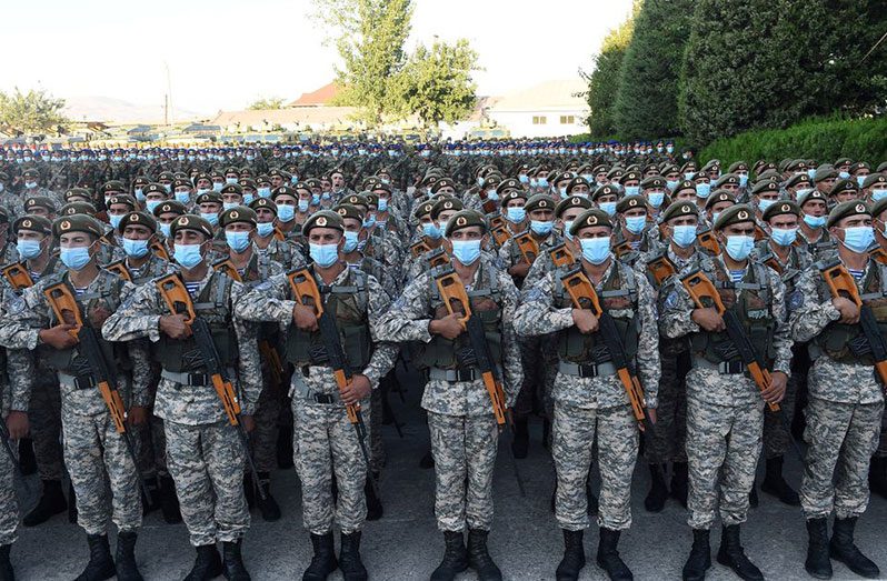 Tajik service members line up during a parade following a nationwide military exercise, in Dushanbe, Tajikistan July 22, 2021 (Tajik Presidential Press Service/Handout via REUTERS)