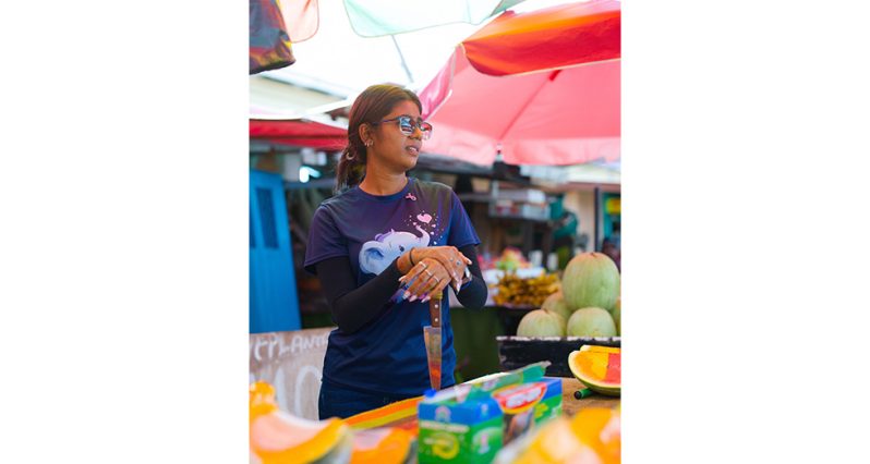 Bourda 1_ Twenty-two-year-old Radha Danpat sells pumpkin seeds at Bourda Market, continuing her family’s long-standing market tradition (Samuel Maughn photo).
