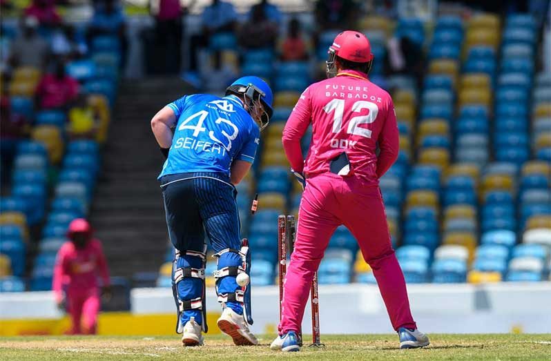 Tim Seifert (L) of Saint Lucia Kings bowled by Jomel Warrican of Barbados Royals during the Men's 2025 Republic Bank Caribbean Premier League match 24 between Barbados Royals and Saint Lucia Kings at Kensington Oval on September 7, 2025, in Bridgetown, Barbados. (Photo by Randy Brooks/CPL T20 via Getty Images)