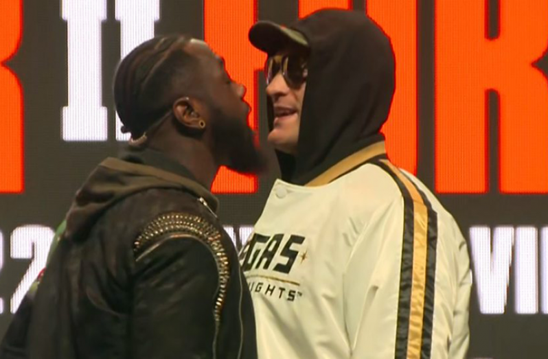 Sparks fly as Deontay Wilder (left) and Tyson Fury face off in their final news conference in Las Vegas before tomorrow's WBC world heavyweight title fight.
