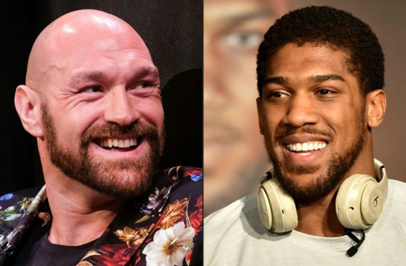 Tyson Fury(left) says he is confident he can beat  Anthony Joshua inside two rounds.