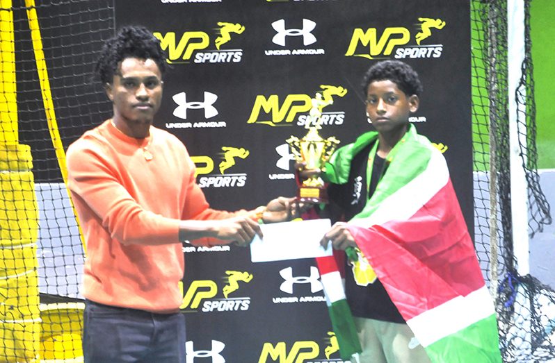 Olimpian Keevin Allicock presents Best School boy Boxer Donn G Sadhoe with tokens from MVP Sports and Smata (Sean Devers photos)