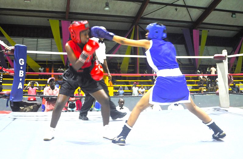 Angelia Rogers (right) executes a left Jab to the head of Tofina Barker