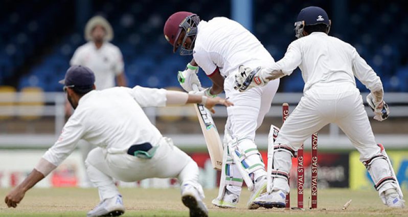 Darren Bravo is cleaned up by R Ashwin, West Indies v India, 4th Test, Port of Spain, 1st day, yesterday. (Associated Press)