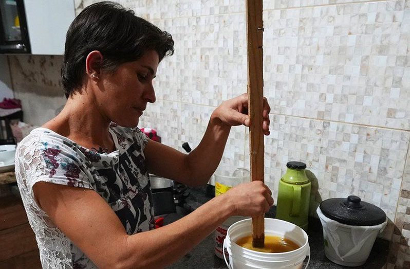 Rosiane Inácio Bulhões de Oliveira making soap in her family home (BBC photo)