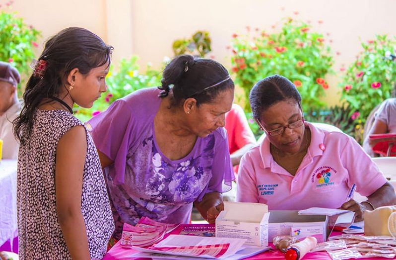 Nurse Audrey Morris (right) during a Breast Cancer outreach session