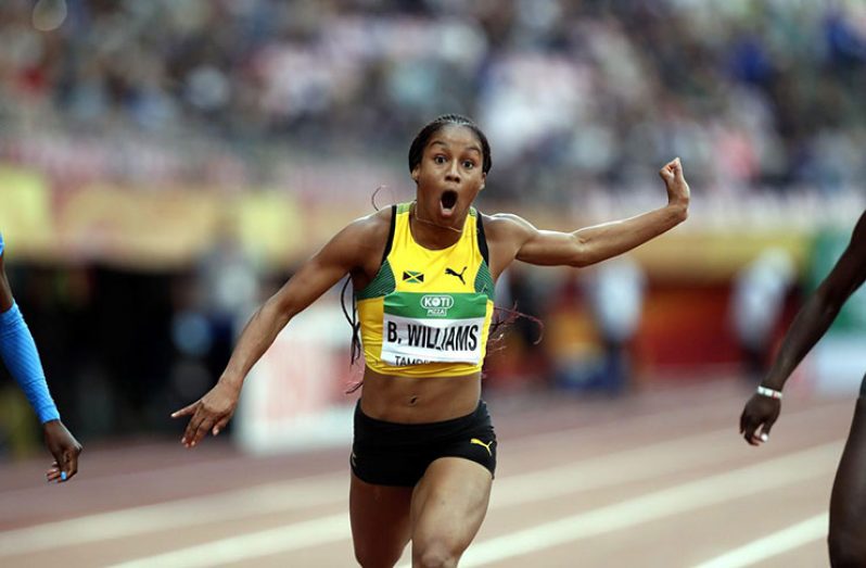 Briana Williams of Jamaica crosses the finish line in Tampere, Finland. (Lehtikuva/Kalle Parkkinen via REUTERS)