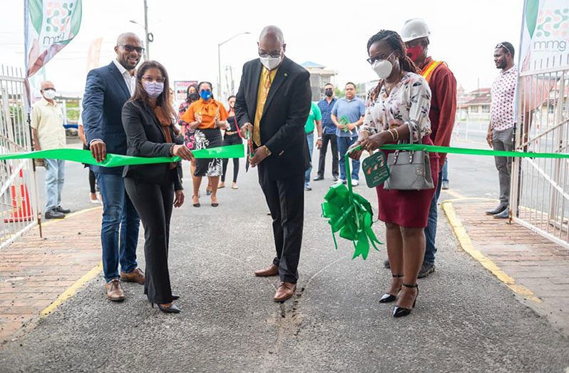 Minister of Public Works, Juan Edghill, cuts the ribbon with General Manager of GTT’s Mobile Money, Bobita Ram and other GTT representatives at the commissioning of the automated tolling system. (Photo: DPI)