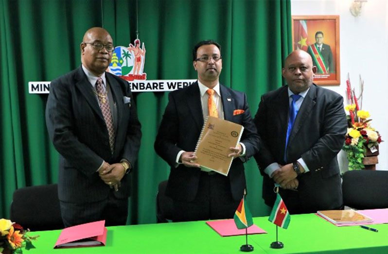 Minister of Public Works, Bishop Juan Edghill (left); Suriname’s Minister of Public Works, Riad Nurmohamed (centre), and another Surinamese official (DPI photo)