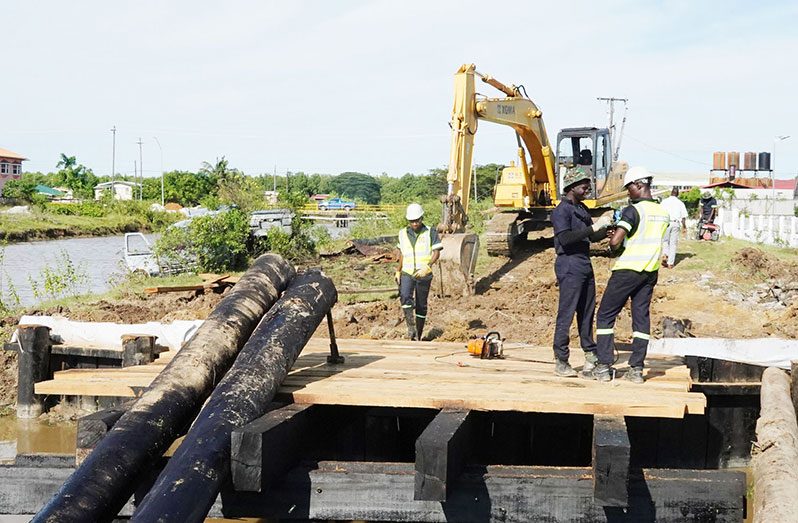 Soldiers during the construction of the Two-Span Heavy Duty Timber Bridge at Catherina Lust, West Coast Berbice, Region Five (GDF photo)