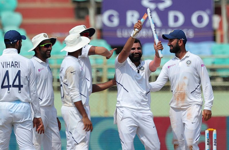 Mohammed Shami shows off a stump his delivery broke © Associated Press