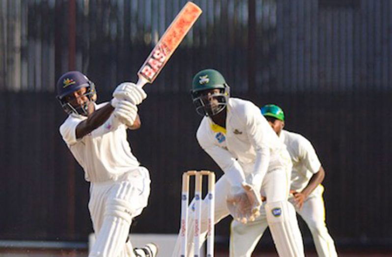 Barbados Pride captain Shamarh Brooks is watched by Jamaica Scorpions wicketkeeper Chadwick Walton and slip fielder John Campbell, as he swings into the leg-side, on the first day of the 10th round match in the Regional 4-Day Championship yesterday at Kensington Oval. (Photo by Kerrie Eversley)
