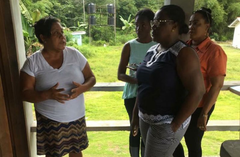 Junior Natural Resources Minister, Simona Broomes, meeting with headteacher of the Kartabo Primary School, Lorna Shanks, during her recent visit to Kartabo