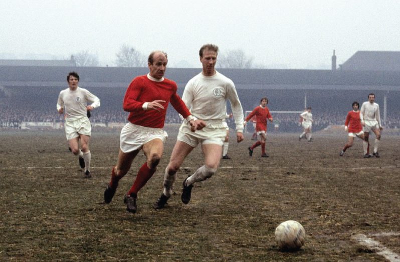 Jack Charlton, in action for Leedsg against youmger brother Bobby, spent his entire 21-year playing career at Leeds, making a joint club record 773 appearances, before retiring as a player in 1973.