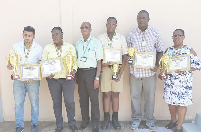 Sentinel Security Operation Manager Cedric Brown poses with the five awardees.