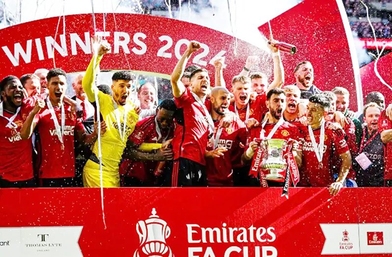 Bruno Fernandes of Manchester United lifts the Emirates FA Cup Trophy after his team's victory in the Emirates FA Cup Final match between Manchester City and Manchester United at Wembley Stadium on May 25, 2024 in London, England. (Photo by Mike Hewitt/Getty Images)