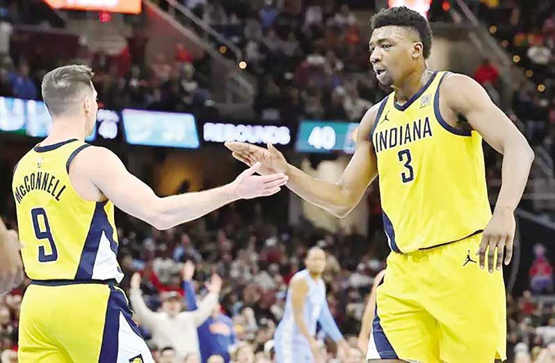 T.J. McConnell (left) and Thomas Bryant (right) scored 19 points between them.