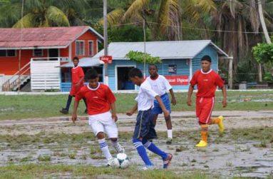 Part of the action between eventual victors St Cuthbert’s Mission (red) and Achievers Academy, which was contested last Sunday at the St Cuthbert’s Mission ground.