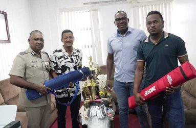 From left: Deputy Commissioner of Police Administration, Ravindradat Budhram, Kemol Savory, Coach Ryan Hercules and Quentin Sampson 