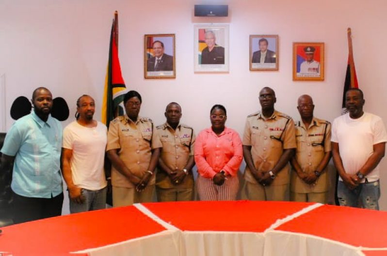 Minister Broomes (centre) is  flanked by Acting Commissioner of Police, Nigel Hoppie (third from right), Deputy Commissioners Paul Williams and Maxine Graham(second and third from left) , Commander Marlon Chapman (second from right) . Deputy Crime Chief, Michael Kingston is at left alongside Promoters Donovan Ravin and Glenroy Watson.