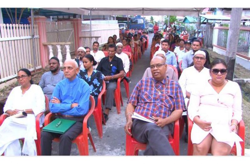 Minister of Communities Ronald Bulkan with other attendees including PPP MPs, Juan Edghill and Priya Manickchand at the Lusignan massacre remembrance.