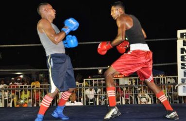‘I am the champion, have respect for me.’ This must be going through the mind of Imran ‘Magic’ Khan (right), who rocks Nandkumar ‘Real Coolie Bully’ Singh with several combinations during their epic welterweight clash last Sunday night.