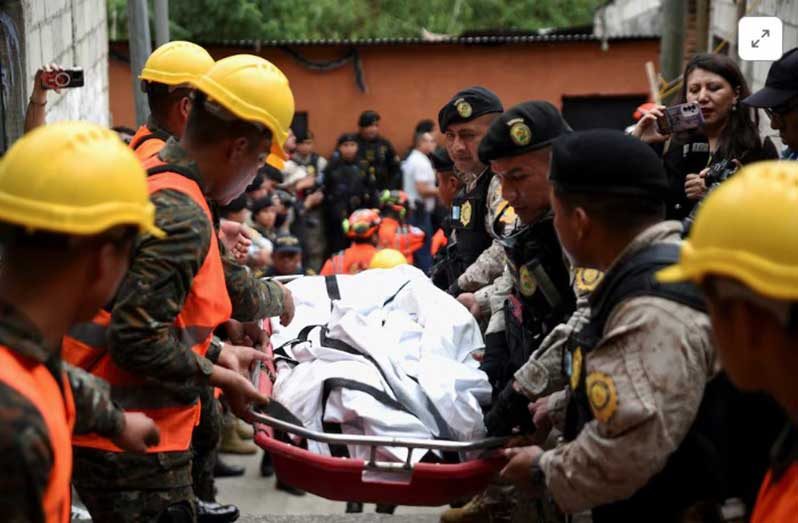 First responders carry the body of a victim following a deadly bus crash, in Guatemala City, Guatemala, February 10, 2025 (REUTERS/Cristina Chiquin) 