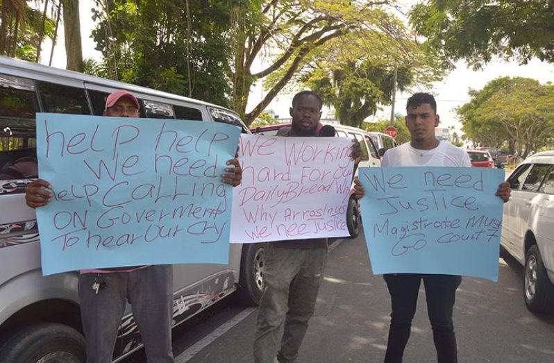 Some of the bus drivers with their placards at the protest on Monday