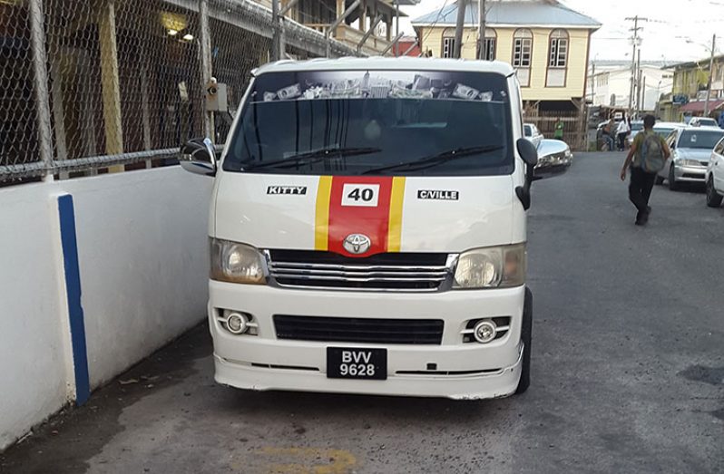 The impounded minibus in front of the Kitty Police Station