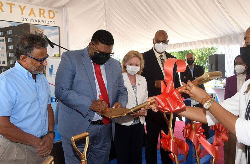 Dr. Irfaan Ali leaving his signature on the spade he used to turn the sod for the construction of the $4B Courtyard Marriott Hotel