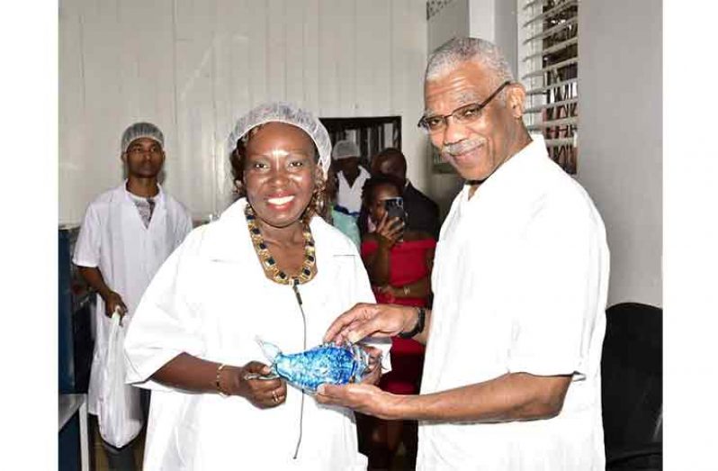 Chief Executive Officer of Global Seafood Distributors, Mrs. Allison Butters-Grant presented President David Granger with a crystal fish paperweight in February, 2018, as a token of appreciation.