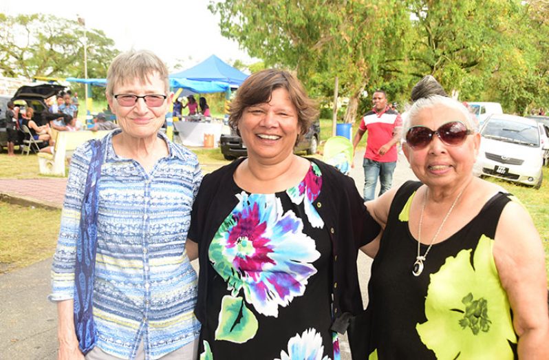 Canada's High Commissioner Ms Lilian Chatterjee (centre) and her friends from Canada, Margaret Mogz (left) and Patsy George (right) at the National Park on Easter Monday (Photo by Adrian Narine)