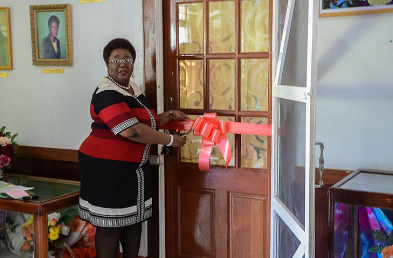 Myrna Lee, Principal of Carnegie School of Home Economics cutting the ribbon to commemorate the auspicious occasion