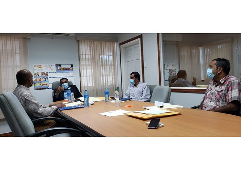 Agriculture Minister, Zulfikar Mustapha, during his meeting with CARDI head, Jhaman Kundun (seated left), Lionel Wordsworth and Madanlall Ramraj (at Minister Mustapha's immediate right)