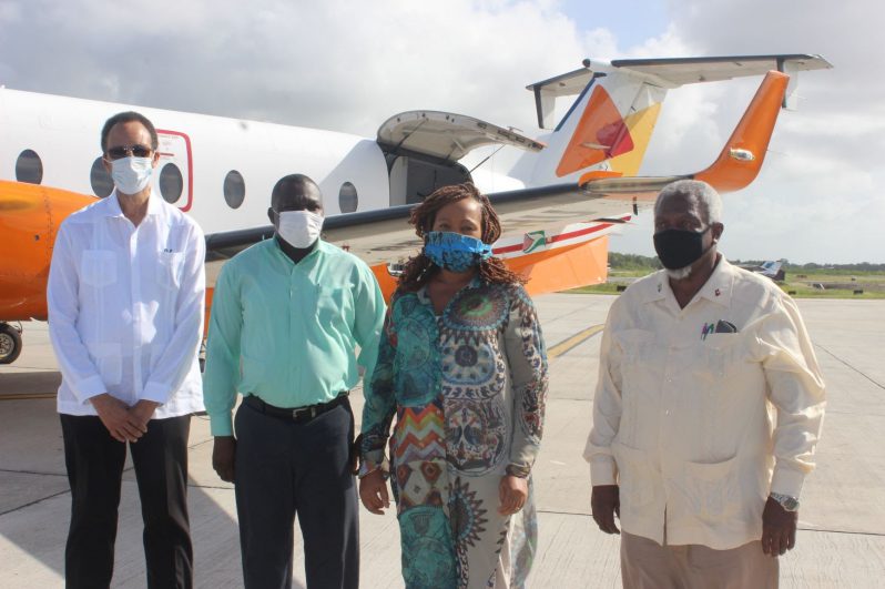 TOUCHDOWN: Ambassador Colin Granderson (left), with members of the CARICOM high-level delegation: Mr. Sylvester King, Ms. Cynthia Barrow-Giles, and Mr. John Jarvis shortly after their arrival mid-afternoon on Friday at the Eugene F. Correia International Airport