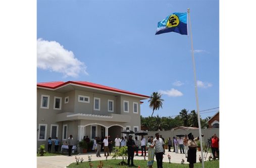 President, Dr Irfaan Ali hands over the new official residence of the CARICOM Secretary-General to the incumbent officeholder, Dr Carla Barnett, at a ceremony in Sparendaam, East Coast Demerara