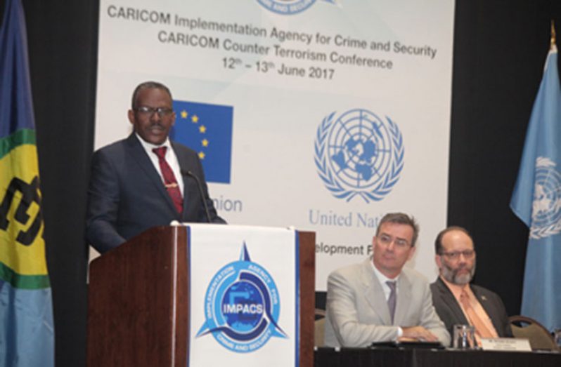 T&T’s Minister of National Security, Mr Edmund Dillon, delivering his address during the formal opening of the CARICOM Counter Terrorism Strategy two-day conference at the Hyatt Regency Hotel Monday. Looking on, from second left, are United Nations Resident Coordinator & UNDP Resident Representative T&T, Mr Richard Blewitt and CARICOM Secretary-General and Chief Executive Officer, Ambassador Irwin LaRocque