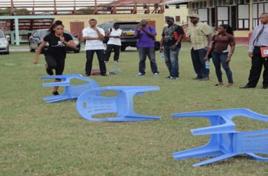 CASTLIN SHOWS: U.S. 100m hurdler Kristi Castlin demonstrates hurdle drills for coaches. Second right is AAG president Aubrey Hutson.
