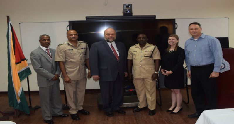 From left to right: US Embassy INL Coordinator Leon Carr III, Guyana Police Force Commissioner Seelall Persaud, US Ambassador Perry L Holloway, Guyana Police Force Training Officer Paul Williams, MetroStar Systems Programme Managers Christine Allgood, and Shai Segall