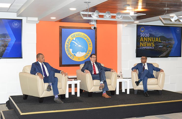 CDB President, Dr Warren Smith (centre) flanked by Daniel Best, CDB Director of Projects and Dr. Justin Ram, CDB Director of Economics, during the conference on Tuesday (Rabindra Rooplall photo)