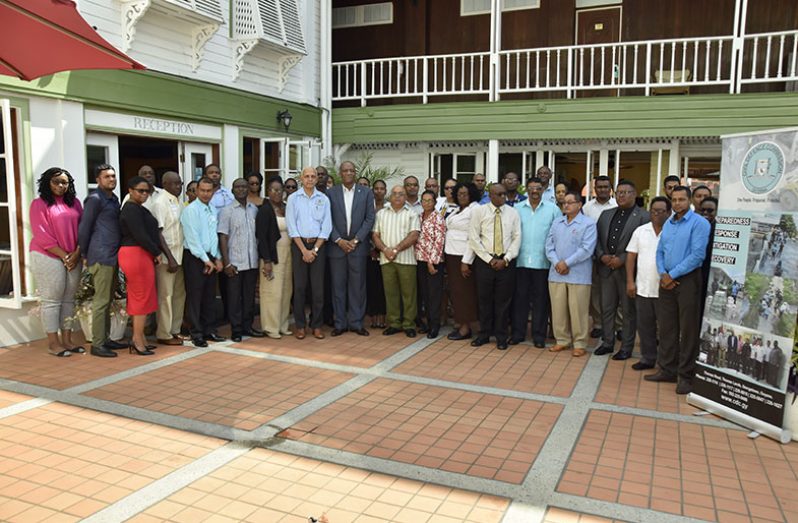 Minister of Communities, Mr. Ronald Bulkan (eighth left-front row) and Minister of State, Mr. Joseph Harmon (ninth left-front row) with the Regional Chairpersons and Regional Executive Officers of the 10 administrative regions at the one-day Regional Disaster Risk Management Conference at Cara Lodge