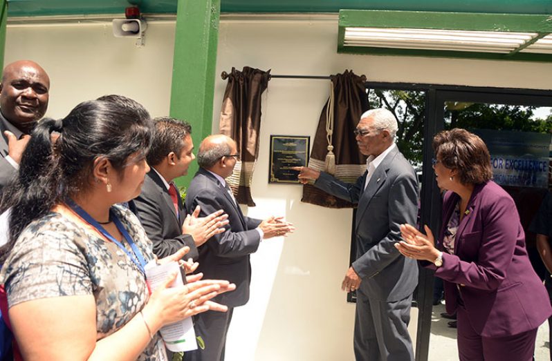 President David Granger unveils the plaque signalling the opening of the Centre for Excellence in Information Technology (CEIT). Also in photo is Minister of Public Telecommunications, Cathy Hughes (right), and High Commissioner of India to Guyana, Venkatachalam Mahalingam (third from right) (Adrian Narine photo)