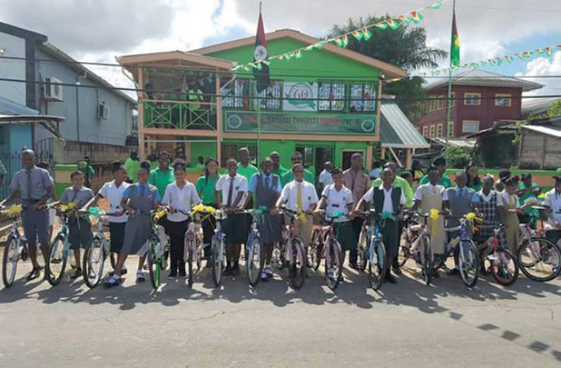 The 27 top performers with their bicycles following the handing-over ceremony