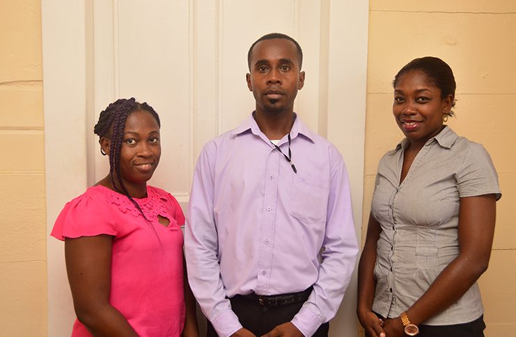 Standing from left are: Programme Coordinator Kaiesha Perry; Monitoring and Evaluation Officer Hasani Tinnie and ChildLinK’s Forensic Interviewer/Counselor Rolanda Campbell (Adrian Narine photo)