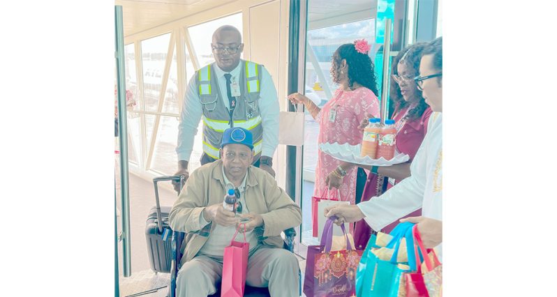 Passengers as they arrived in Guyana via CJIA being welcomed for Diwali celebrations with sweet treats and local fruit juices (Japheth Savory photos)