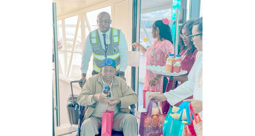 Passengers as they arrived in Guyana via CJIA being welcomed for Diwali celebrations with sweet treats and local fruit juices (Japheth Savory photos)